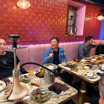 Guests at a table with shisha