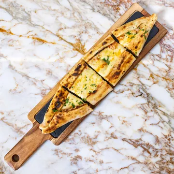 Cheese pide on a board