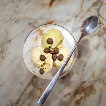 Three scoops of ice cream in a bowl